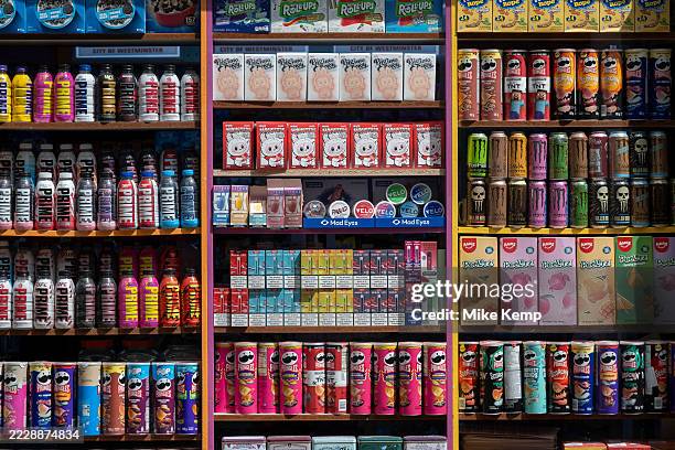 Prime energy drinks alongside snacks, vapes and Monster drinks for sale in a shop on th August 2025 in London, United Kingdom. Prime is a range of...