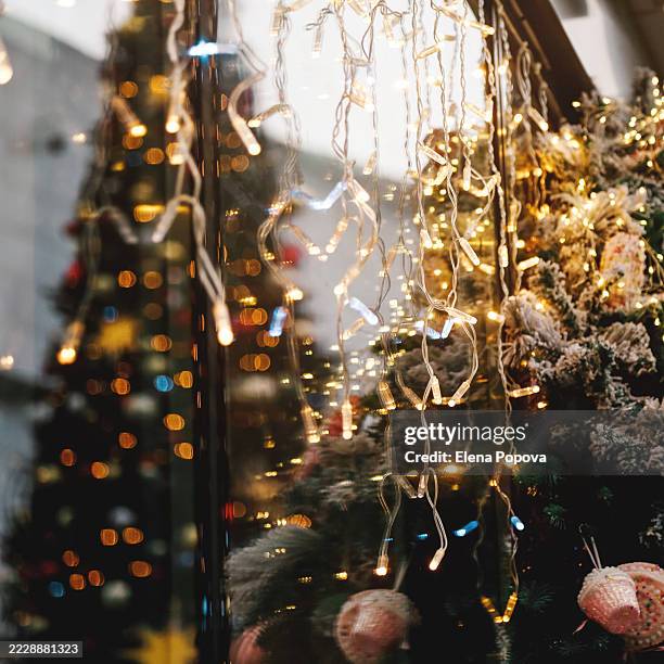 Full Frame Christmas Festive Decorations Fir Tree Branches And Glittering Garlands On New Years Eve High-Res Stock Photo