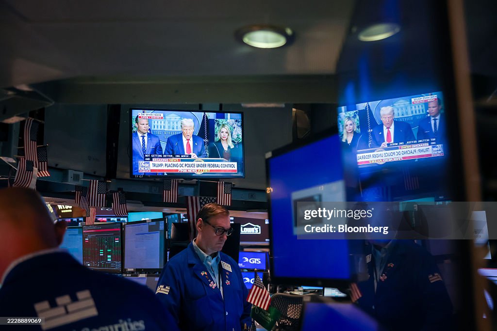 Traders At The NYSE As Stocks Hold Near Record Before Key Inflation Data