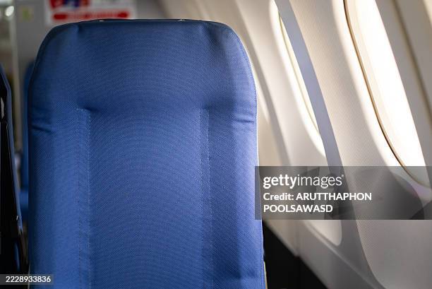 seats and window in cabin airplane - flugzeugsitz stock-fotos und bilder