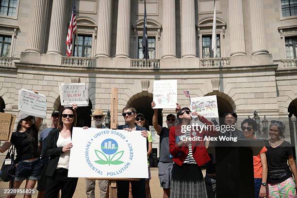 Environmental activists unveil a new logo to rename the U.S. Environmental Protection Agency to "U.S. Environmental Pollution Agency" during a...