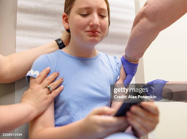 Injection Distraction 535 Preteen Girl Getting Injection Stock Photos, High-Res Pictures, and ...