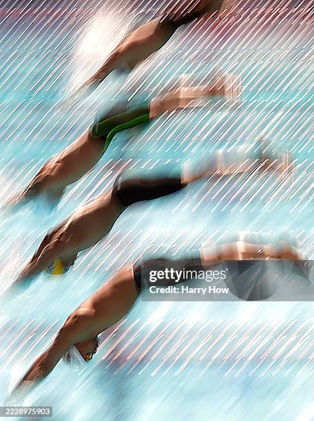 Logan Noguchi, Julian Koch and Caeleb Dressel leave the starting block in the Men 50 Meter Butterfly during day three of the TYR Summer Championships...
