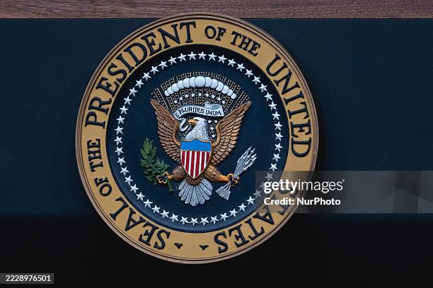 The US Presidential seal on the podium in James Brady Press Briefing Room at the White House, ahead of President Donald Trump's presser, Monday, Aug....