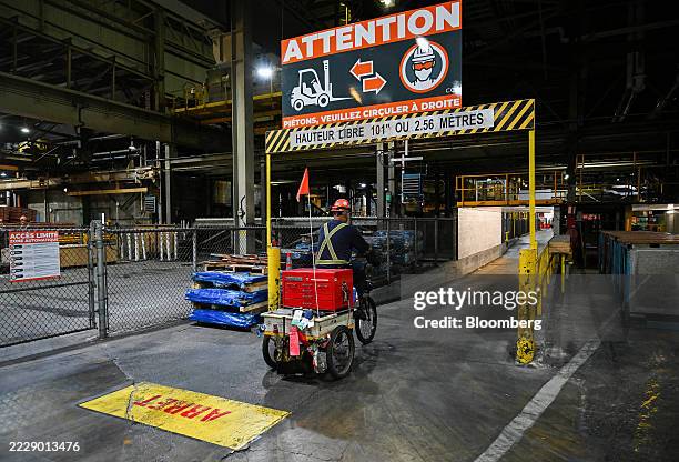 Worker rides a tricycle at the Glencore Canadian Copper Refinery in Montreal, Quebec, Canada on Tuesday, Aug. 12, 2025. The refinery has a production...