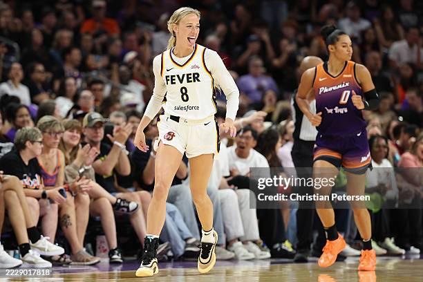 Sophie Cunningham of the Indiana Fever reacts to a three-point shot ahead of Satou Sabally of the Phoenix Mercury during the second half of the WNBA...