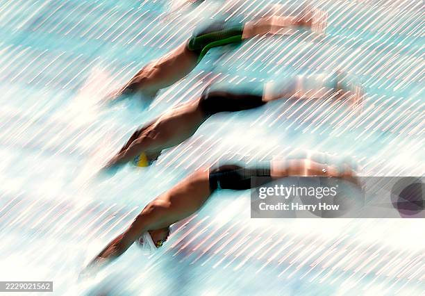 Logan Noguchi, Julian Koch and Caeleb Dressel leave the starting block in the Men 50 Meter Butterfly during day three of the TYR Summer Championships...