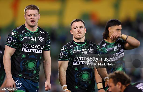 Nolan Stringer Raiders players warm up before the round 23 NRL match between... News ...