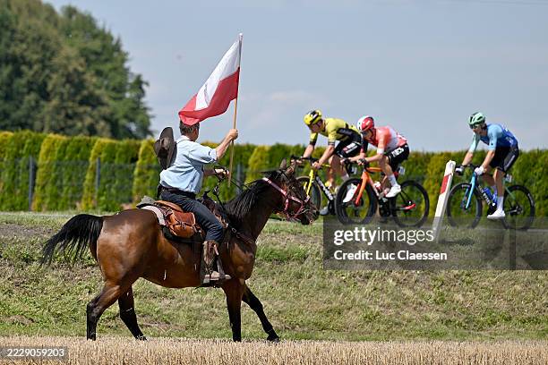General view of the peloton competing while fans cheer riding horses during the 82nd Tour de Pologne 2025, Stage 5 a 206.1km stage from Katowice to...