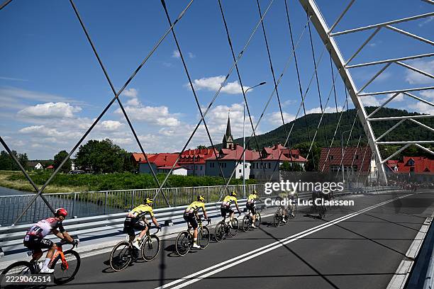 Michal Kwiatkowski of Poland and Team INEOS Grenadiers, Olav Kooij of Netherlands and Team Visma | Lease a Bike and a general view of the peloton...