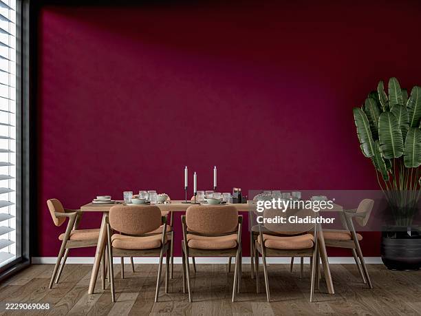 a modern but retro dining room with a full (set) table and chairs, a potted plant near a window, '70s retro style furniture - renovation of upholstered furniture stock pictures, royalty-free photos & images