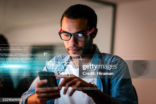 Focused Software Developer Working With Technology and Digital Graphics Overlay Focused Software Developer Working With Technology and Digital Graphics Overlay