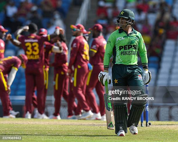 Naseem Shah of Pakistan walks off the field dismissed by Jayden Seales of West Indies during the third One Day International cricket match between...