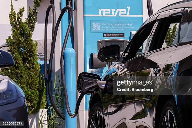 Ride-share driver uses a Revel electric vehicle charging station in the Brooklyn borough of New York, US, on Tuesday, Aug. 12, 2025. Revel Transit...