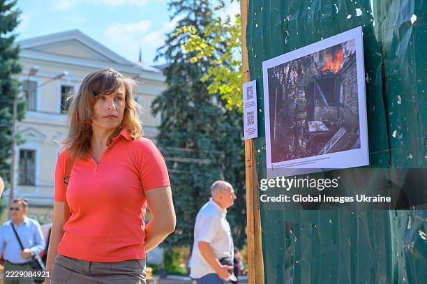 Woman visits exhibition ‘Fireproof’ dedicated to 24th Mechanized Brigade on Square of Contracts on August 8, 2025 in Kyiv, Ukraine. A photo...
