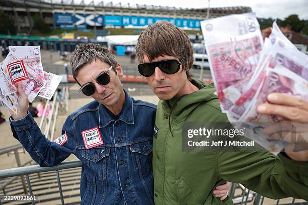 Oasis lookalikes of Liam and Noel Gallagher pose for photographs outside Murrayfield Stadium to promote artist Alison Jackson's Edinburgh Fringe...