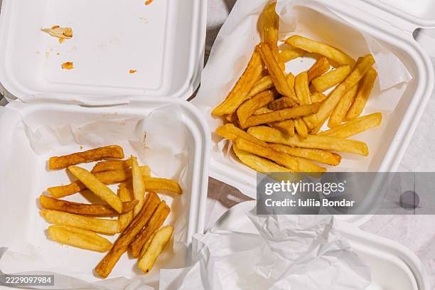 leftover chips in takeaway containers after a meal - leftovers stock pictures, royalty-free photos & images