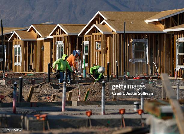 Construction workers build homes at a new housing development on August 08, 2025 in Henderson, Nevada. Las Vegas has seen a drastic 7 percent...