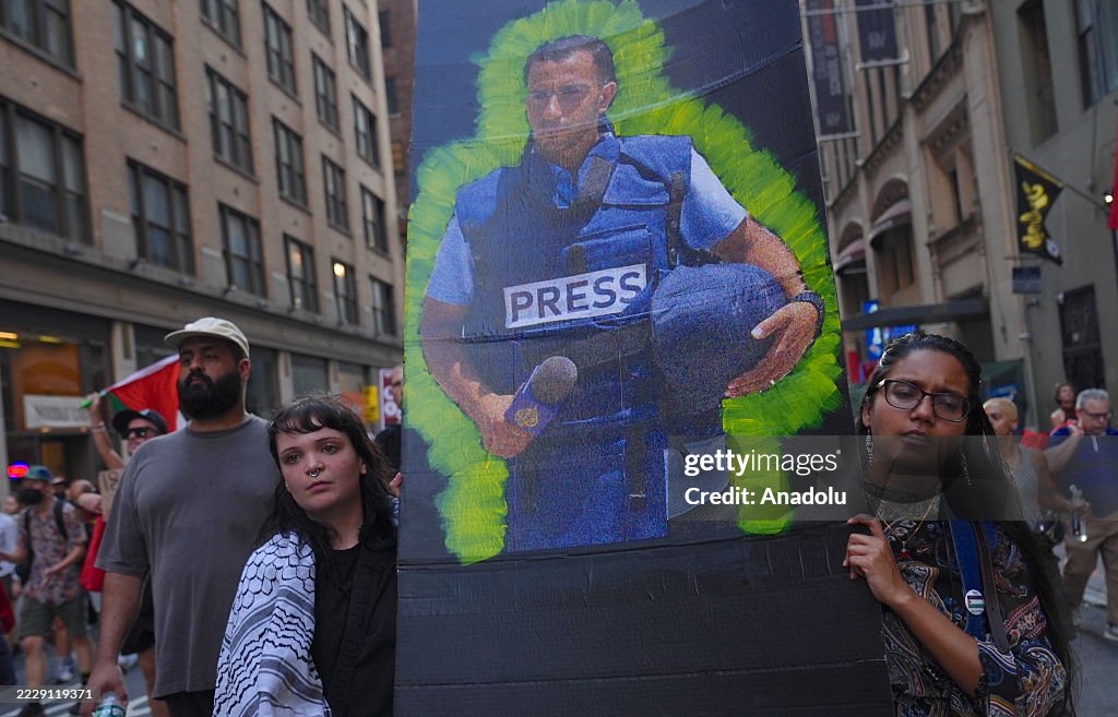 Demonstrators rally outside the New York Times to protest the killing of journalists in Gaza