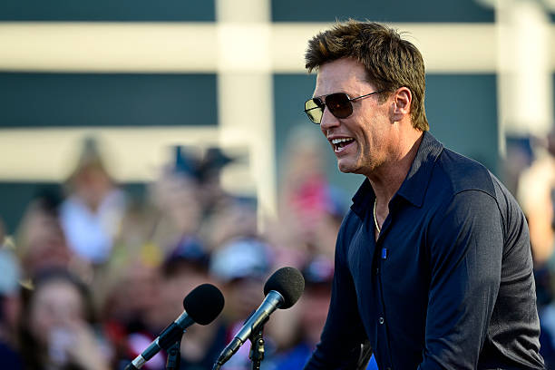 Former NFL player Tom Brady speaks during his statue unveiling ceremony prior to the NFL Preseason 2025 game between Washington Commanders and New...