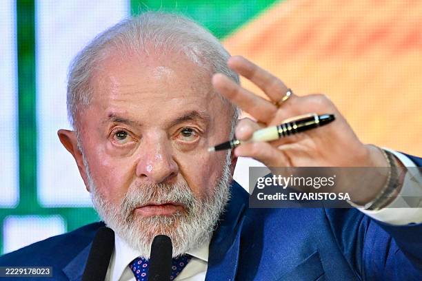 Brazil's President Luiz Inacio Lula da Silva gestures as he speaks during the signing of a decree with measures to mitigate the economic impact of...