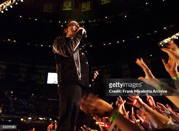 Singer Bono performing on the Super Bowl XXXVI - Halftime Show at the Louisiana Superdome in New Orleans, LA., 2/3/02. Photo by Frank...