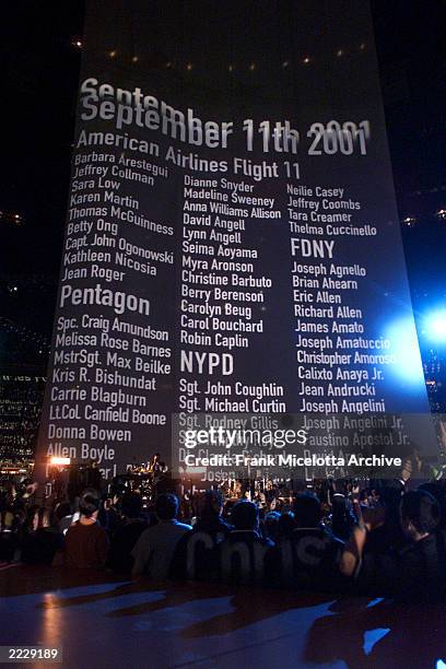 Performing while a list of people who died in the September 11th tragedy's scrolls behind them on the Super Bowl XXXVI - Halftime Show at the...