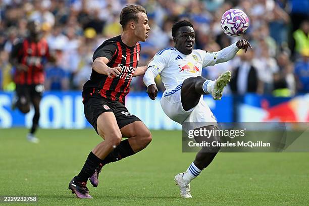 Wilfried Gnonto of Leeds United controls the ball under pressure from Vittorio Magni of AC Milan during the pre-season friendly match between Leeds...