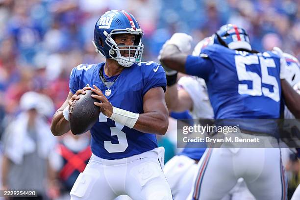 Russell Wilson of the New York Giants looks to throw a pass during the first quarter of an NFL Preseason 2025 game between New York Giants and...