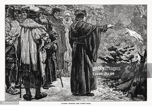 martin luther burns the pope's bull, wood engraving, published 1899 - protestantism stock illustrations