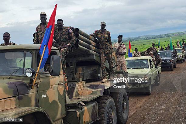 Sudanese army soldiers parade in the streets of eastern Sudan's city of Gedaref on August 14, 2025 to mark the 71st anniversary of the formation of...
