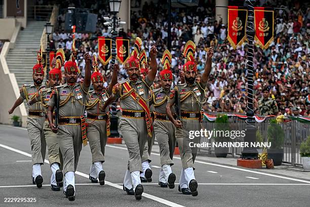 Indian Border Security Force personnel perform during the beating retreat ceremony at the Attari-Wagah border between Pakistan and India, on the...