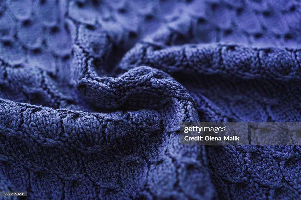 Close-Up of Purple Knitted Fabric with Textured Patterns