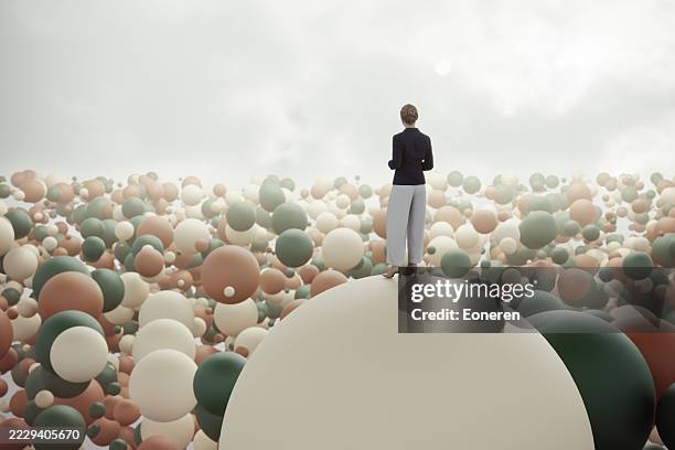 businesswoman standing on sphere in abstract world - complexity stock pictures, royalty-free photos & images