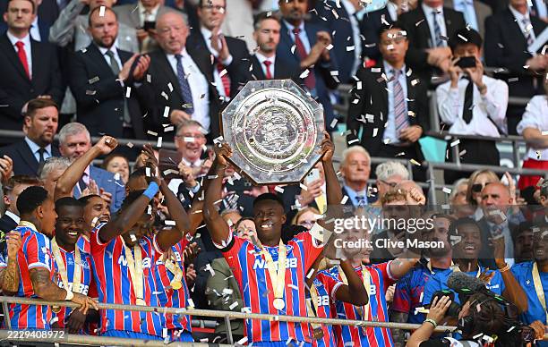 Marc Guehi of Crystal Palace lifts the FA Community Shield after his team's victory following the 2025 FA Community Shield match between Crystal...