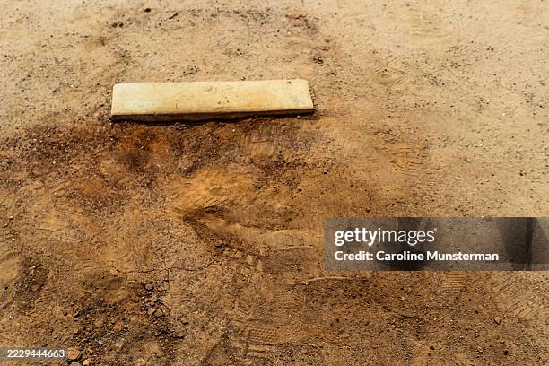 baseball pitcher's mound with signs of wear and texture in the middle of summer.