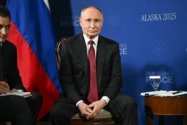 Russian President Vladimir Putin looks on during a US-Russia summit on Ukraine with US President Donald Trump at Joint Base Elmendorf-Richardson in...