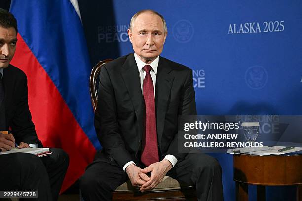 Russian President Vladimir Putin looks on during a US-Russia summit on Ukraine with US President Donald Trump at Joint Base Elmendorf-Richardson in...