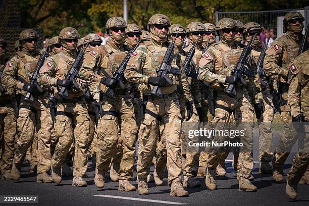 Polish armoured vehicles and soldiers march thourgh the city during the annual military parade in Warsaw, Poland on 15 August, 2025. Taking part in...