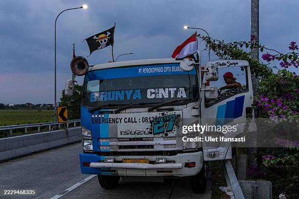 Pirate flag from the Japanese anime 'One Piece' is displayed on a truck on August 10, 2025 in Karanganyar, Central Java, Indonesia. On social media,...