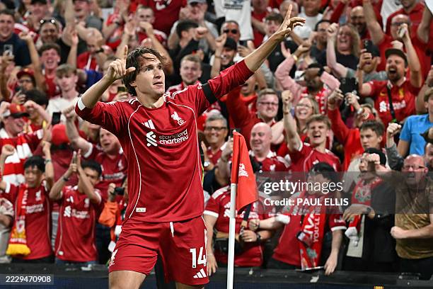 Liverpool's Italian striker Federico Chiesa celebrates scoring their third goal during the English Premier League football match between Liverpool...