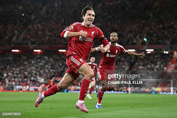 Liverpool's Italian striker Federico Chiesa celebrates after scoring their third goal during the English Premier League football match between...