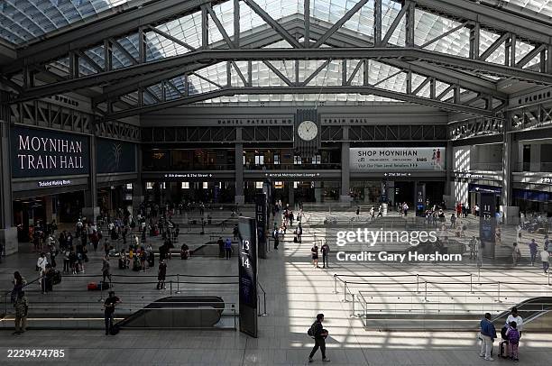 People walk through the Moynihan Train Hall at Penn Station on August 9 in New York City.