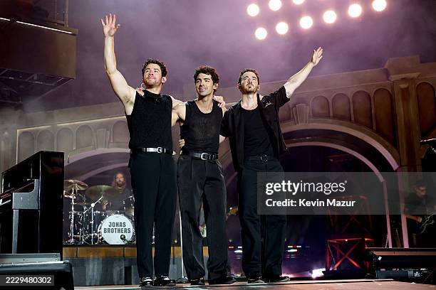 Nick Jonas, Joe Jonas, and Kevin Jonas perform onstage during the Jonas Brothers: JONAS20 Greetings From Your Hometown tour kick off at Met Life...