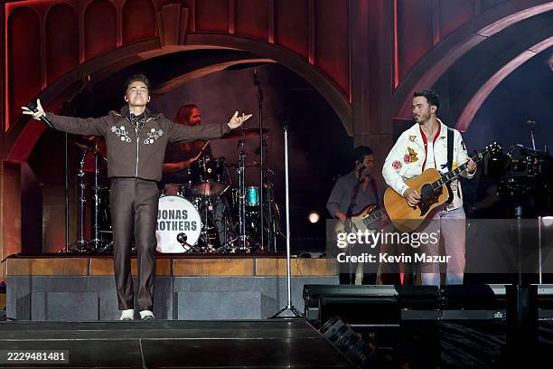 Jesse McCartney and Kevin Jonas perform onstage during the Jonas Brothers: JONAS20 Greetings From Your Hometown tour kick off at Met Life Stadium on...