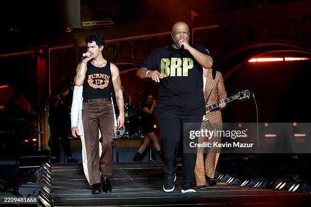 Joe Jonas and Big Rob perform onstage during the Jonas Brothers: JONAS20 Greetings From Your Hometown tour kick off at Met Life Stadium on August 10,...