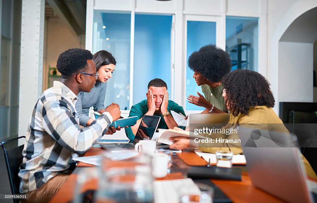 Team Collaborates Intently During a Lively Boardroom Discussion