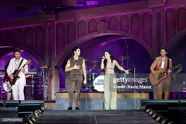 Nick Jonas, Joe Jonas, Demi Lovato, and Kevin Jonas perform onstage during the Jonas Brothers: JONAS20 Greetings From Your Hometown tour kick off at...