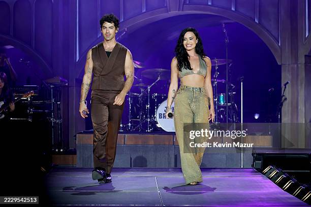 Joe Jonas and Demi Lovato perform onstage during the Jonas Brothers: JONAS20 Greetings From Your Hometown tour kick off at Met Life Stadium on August...