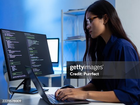 Asian Female Software Developer Working on Code Software Project in Tech Office Asian Female Software Developer Working on Code Software Project in Tech Office